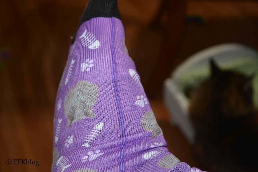 a side view of a pair of purple custom socks from Socksery